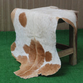 Elegant Brown and White Goat Hide Rug - Perfect Accent for Living Room or Bedroom