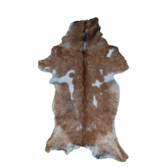 Elegant Brown and White Goat Hide Rug - Perfect Accent for Living Room or Bedroom