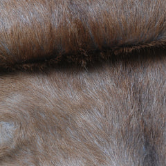 Elegant Brown and White Goat Hide Rug - Perfect Accent for Living Room or Bedroom