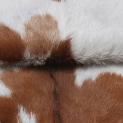 Handcrafted Brown and White Goat Skin Rug - Soft, Durable, and Elegant Décor