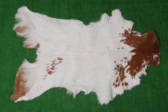 Handcrafted Brown and White Goat Skin Rug - Soft, Durable, and Elegant Décor