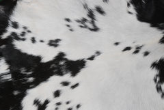 Stylish Black and White Goat Hide Rug - Unique Natural Pattern for Modern Homes
