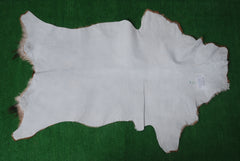 Elegant Brown and White Goat Hide Rug - Perfect Accent for Living Room or Bedroom