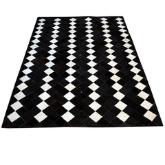 Luxurious Handmade Cowhide Patchwork Rug with Zig Zag Stitching - Unique Leather Area Rug for Home Décor - Customizable Designs Available