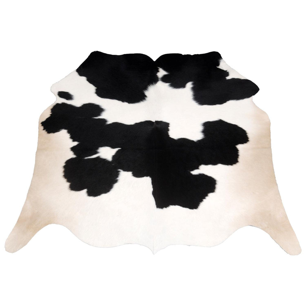 Luxurious Handcrafted Black and White Cowhide Rug - Hypoallergenic, Non-Slip Backing, Unique Markings - Durable and Versatile Home Decor - Celestial Leather Limited