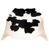 Luxurious Handcrafted Black and White Cowhide Rug - Hypoallergenic, Non-Slip Backing, Unique Markings - Durable and Versatile Home Decor - Celestial Leather Limited