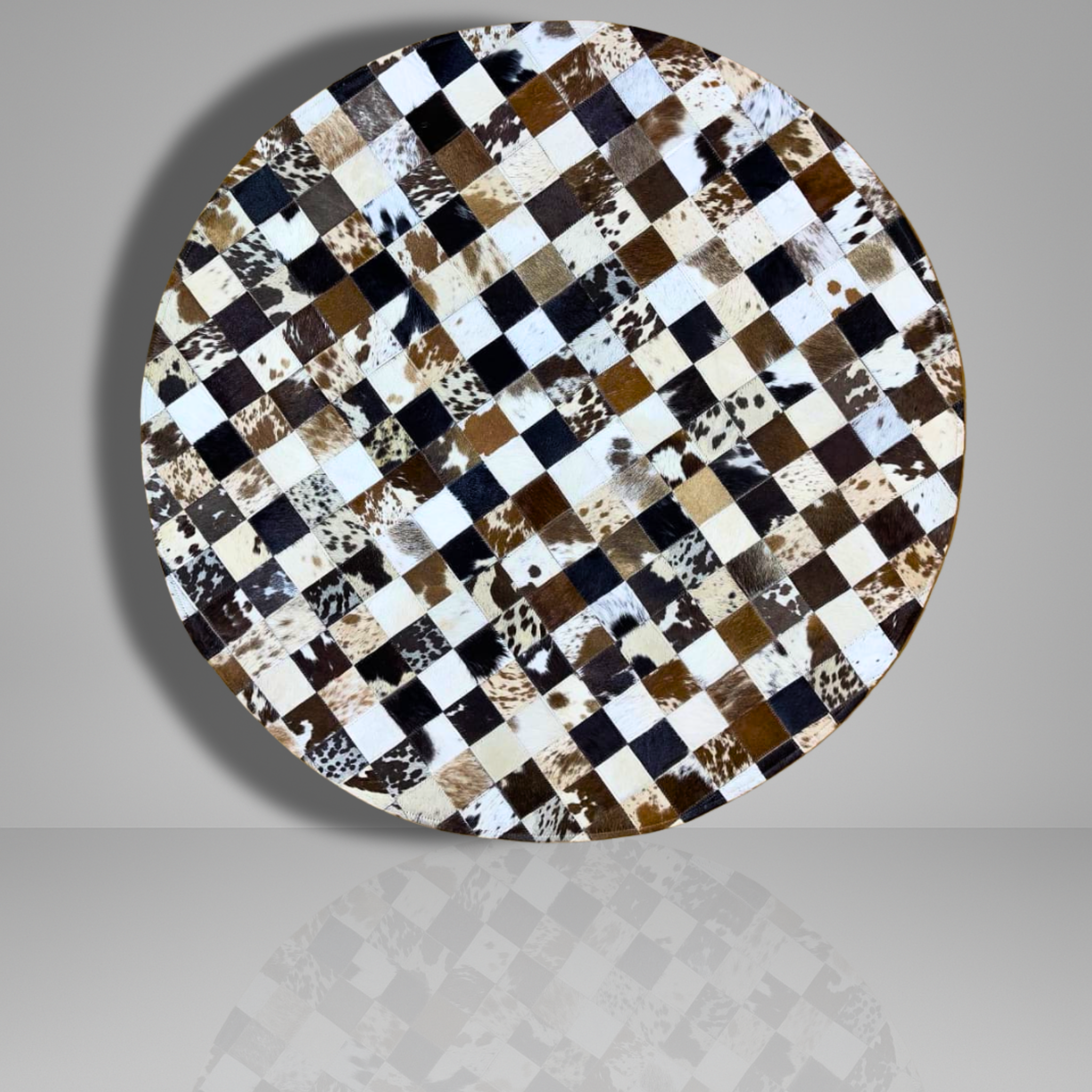 Round table top with a checkered pattern of brown, black, and white on a gray background