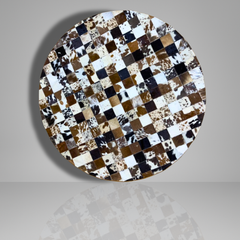 Round table with a checkered cowhide pattern on a gray background