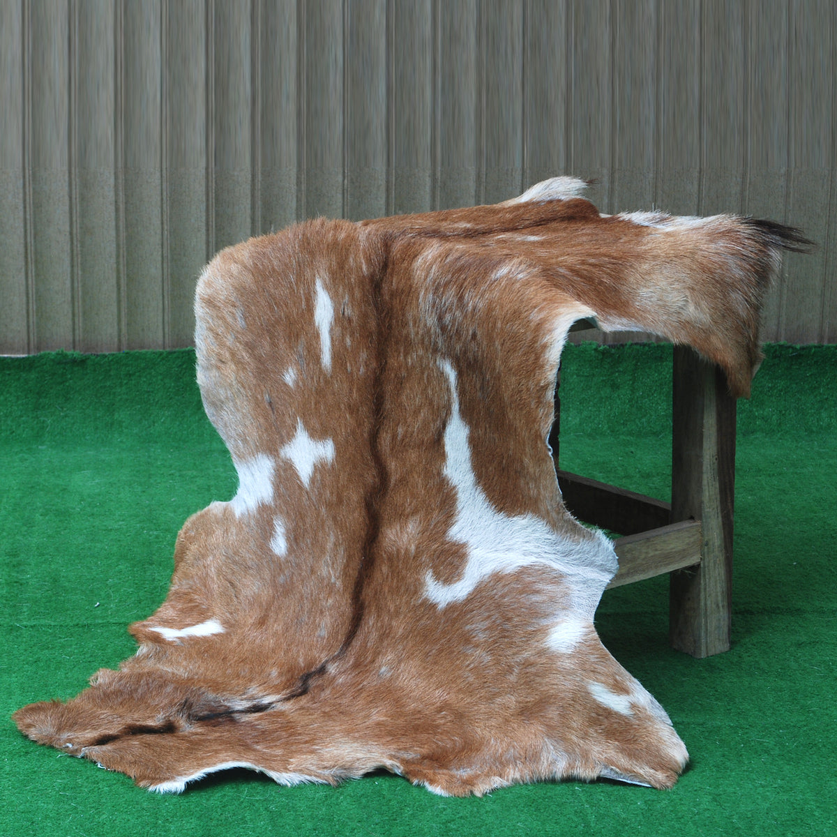 Elegant Brown and White Goat Hide Rug - Perfect Accent for Living Room or Bedroom