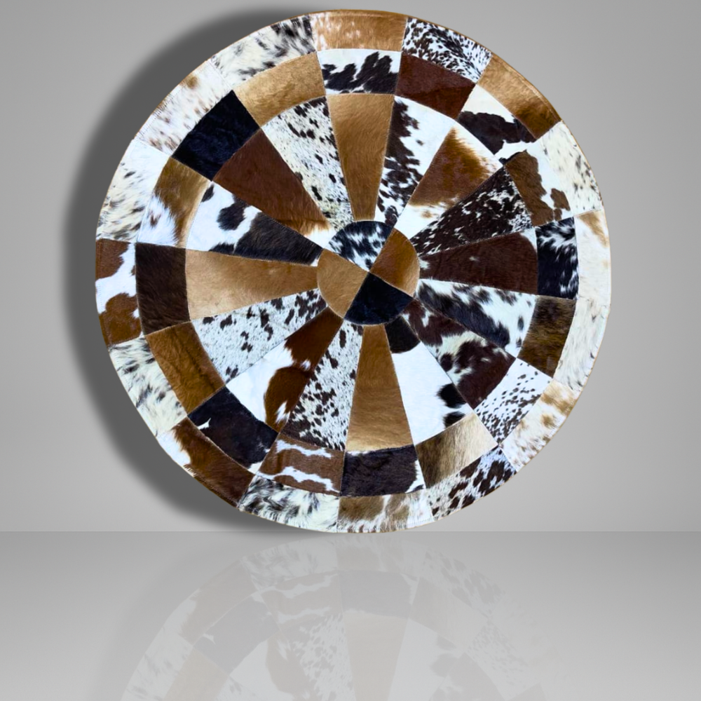 Round table top with cowhide pattern on a gray background