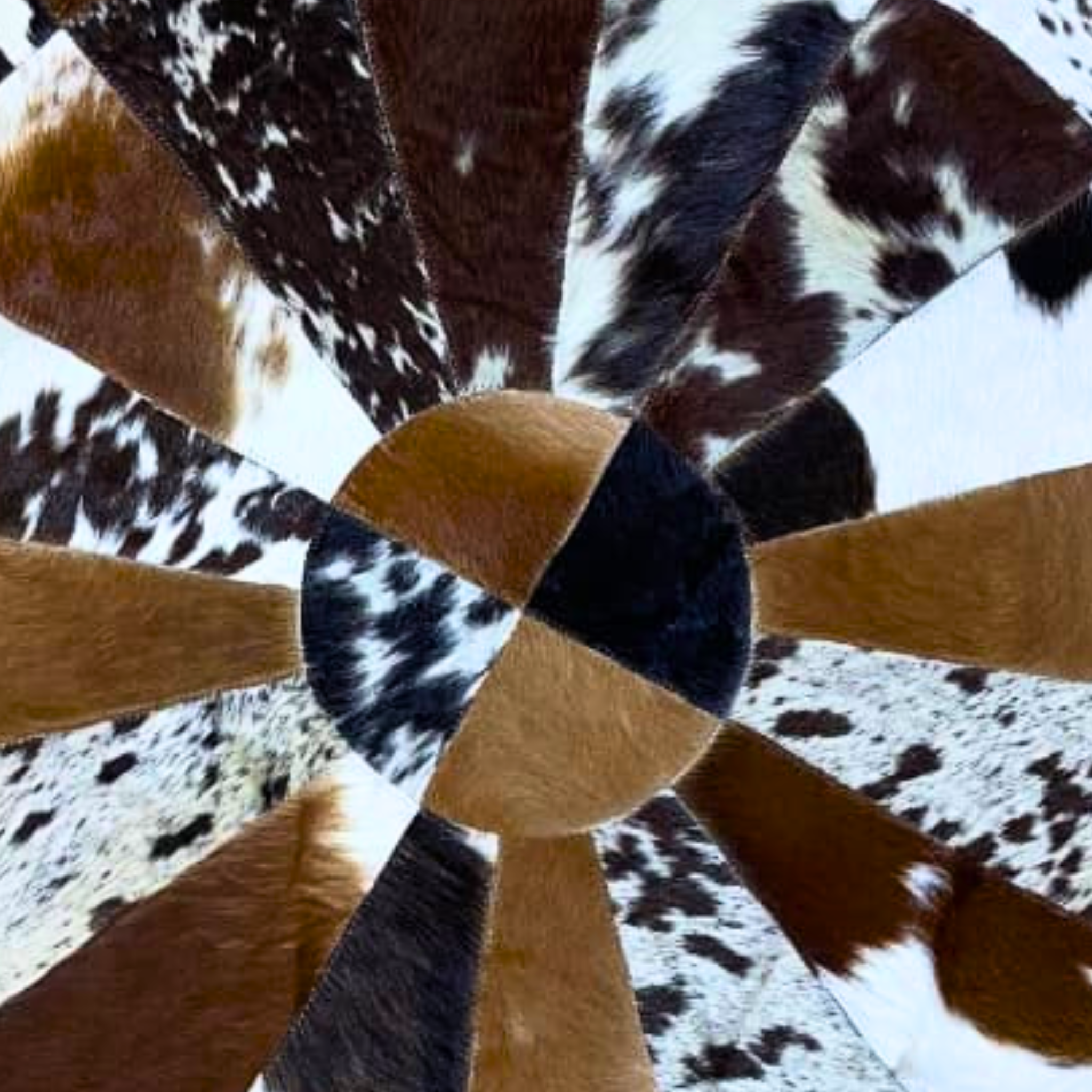 Close-up of a cowhide rug with brown, black, and white pattern