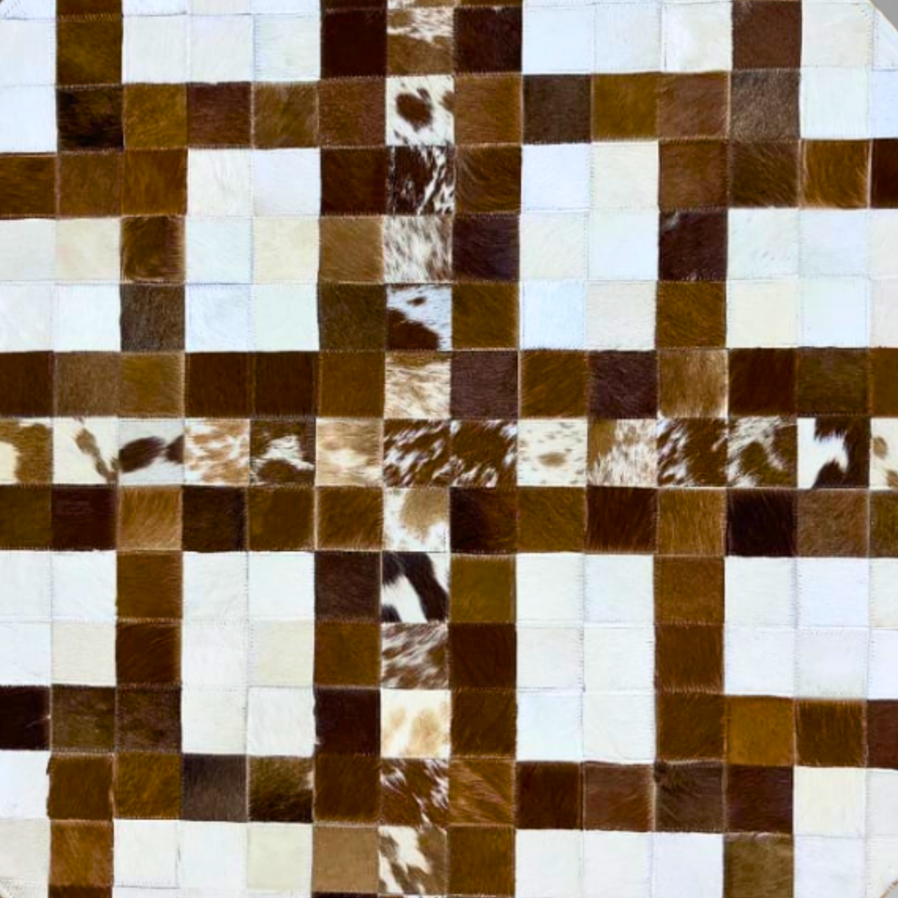 Checkered pattern of brown, white, and black cowhide leather tiles.