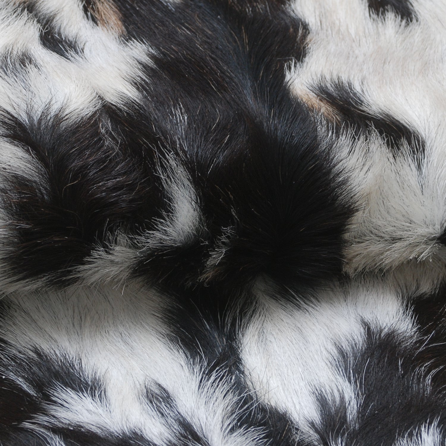 Decorative Black and White Goat Skin Rug - Genuine Leather for Sophisticated Spaces