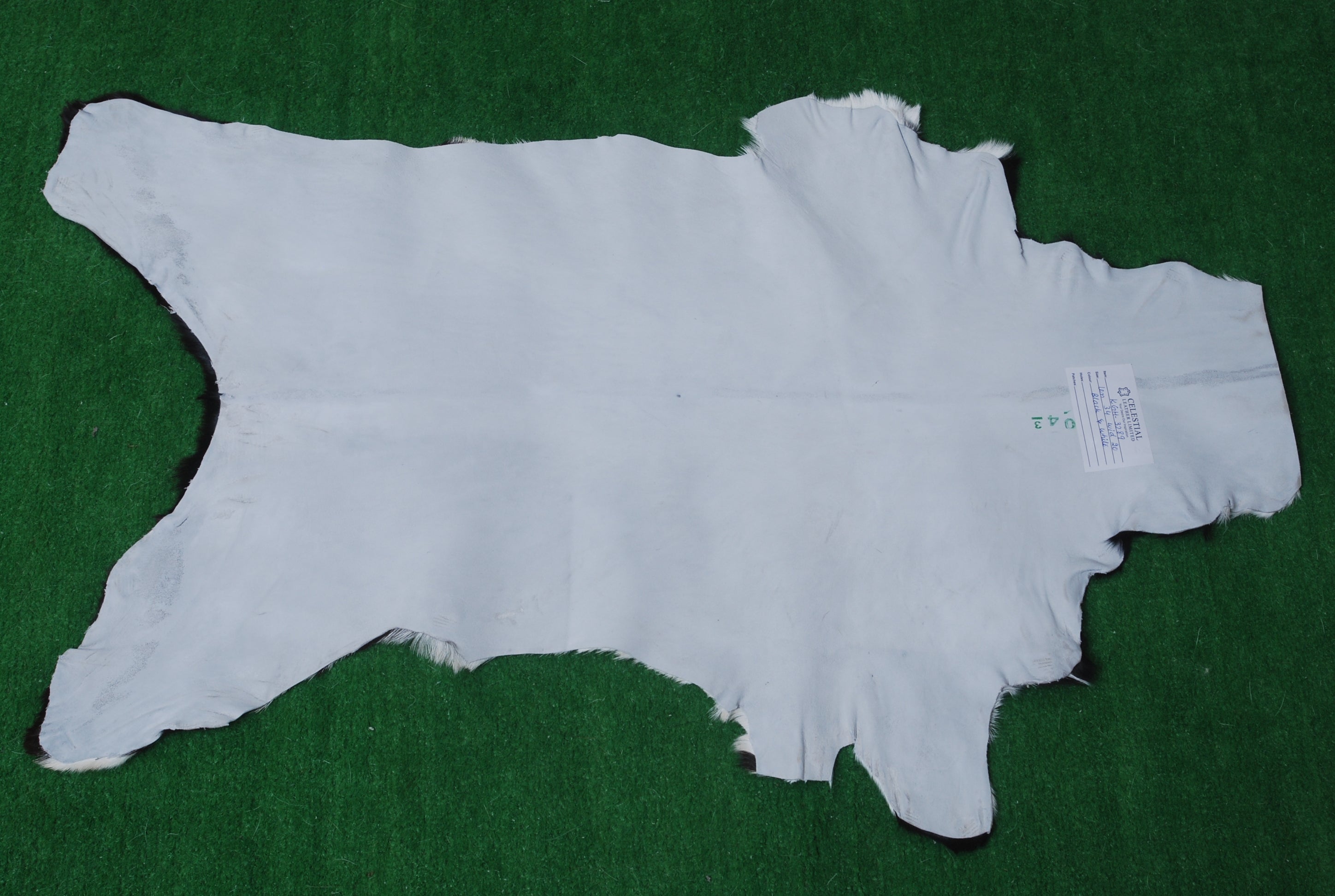 Decorative Black and White Goat Skin Rug - Genuine Leather for Sophisticated Spaces