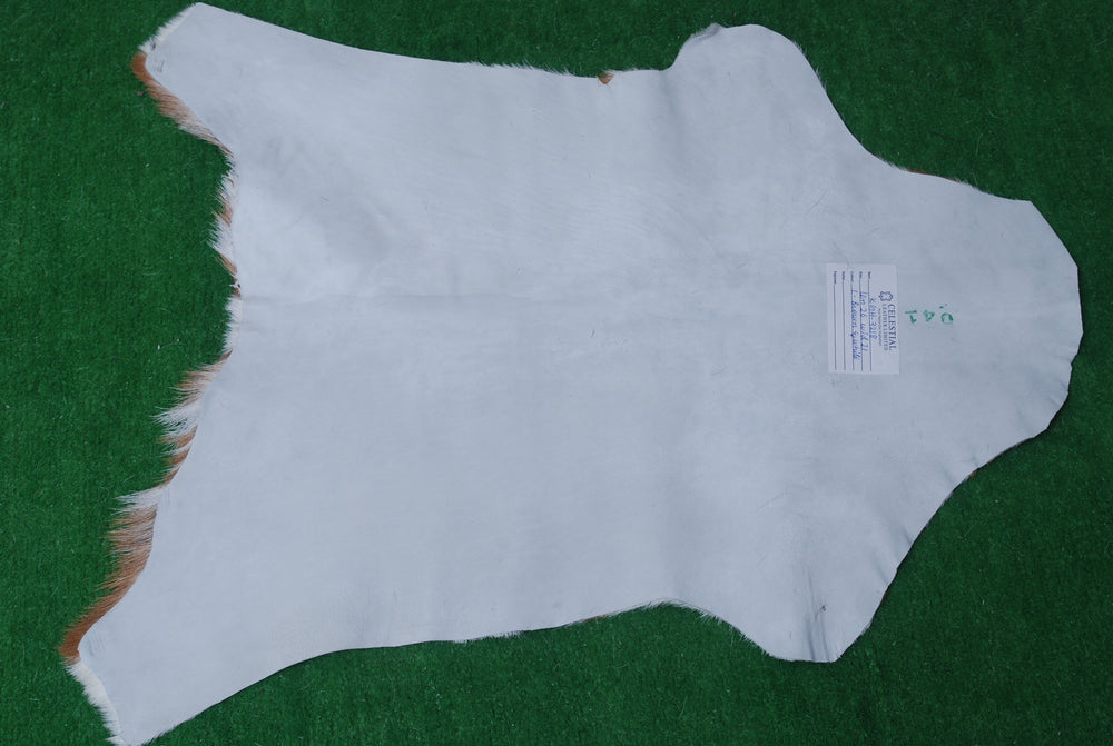 Luxurious Brown and White Goat Hide Rug - Hypoallergenic, Non-Shedding, Eco-Friendly Rug with Non-Slip Backing for Stylish Home Décor - Celestial Leather Limited