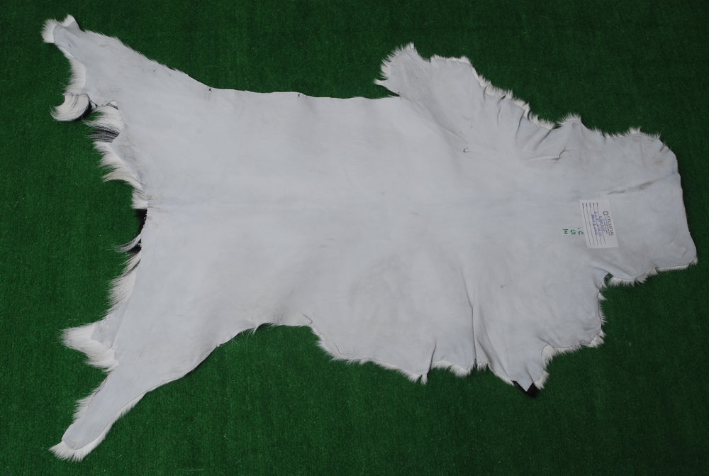 Luxurious Natural Brown & White Goat Skin Rug - Modern Sophistication for Home Decor - Celestial Leather Limited