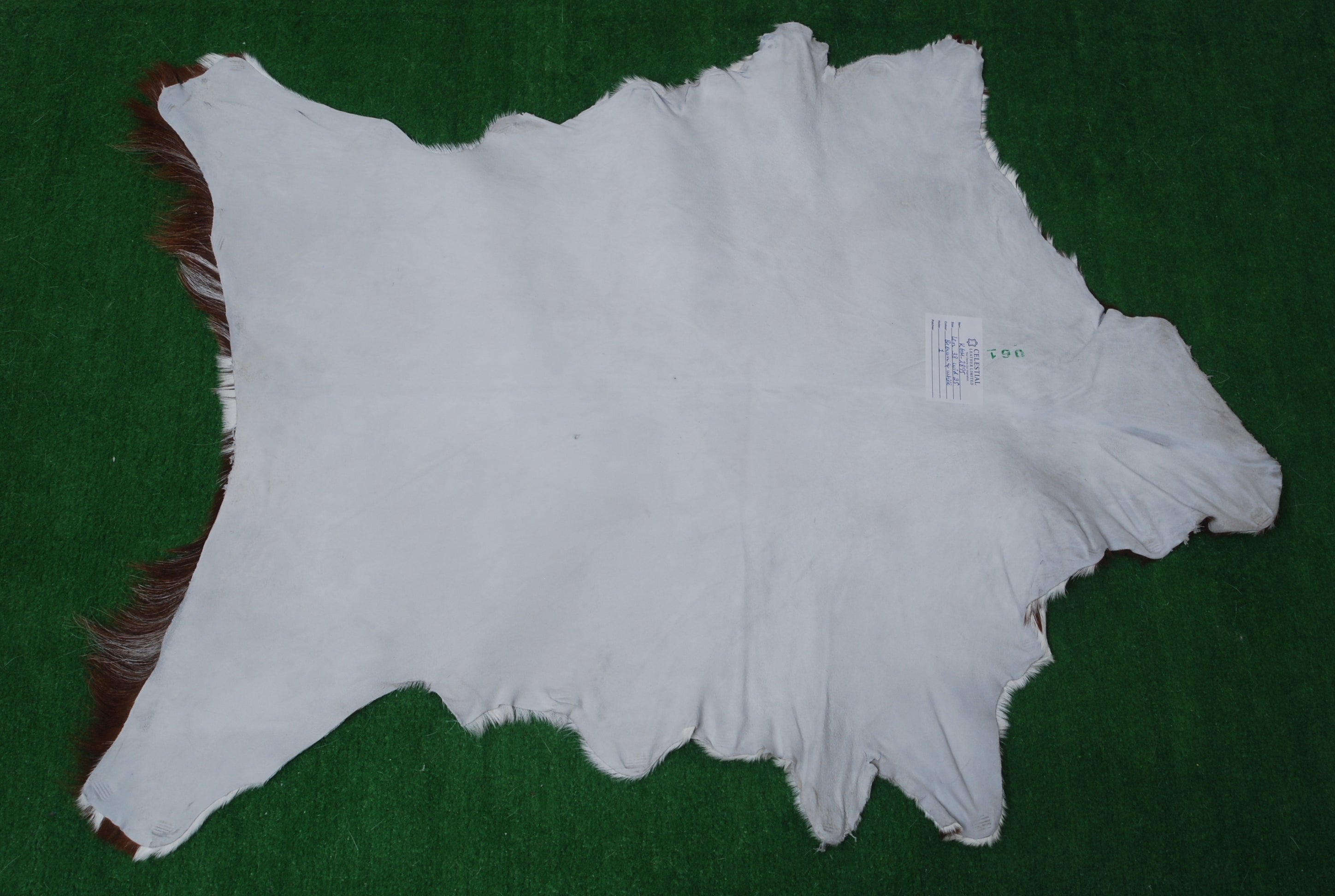 Brown and White Handmade Goat Skin Rug – Classic Elegance for Your Home