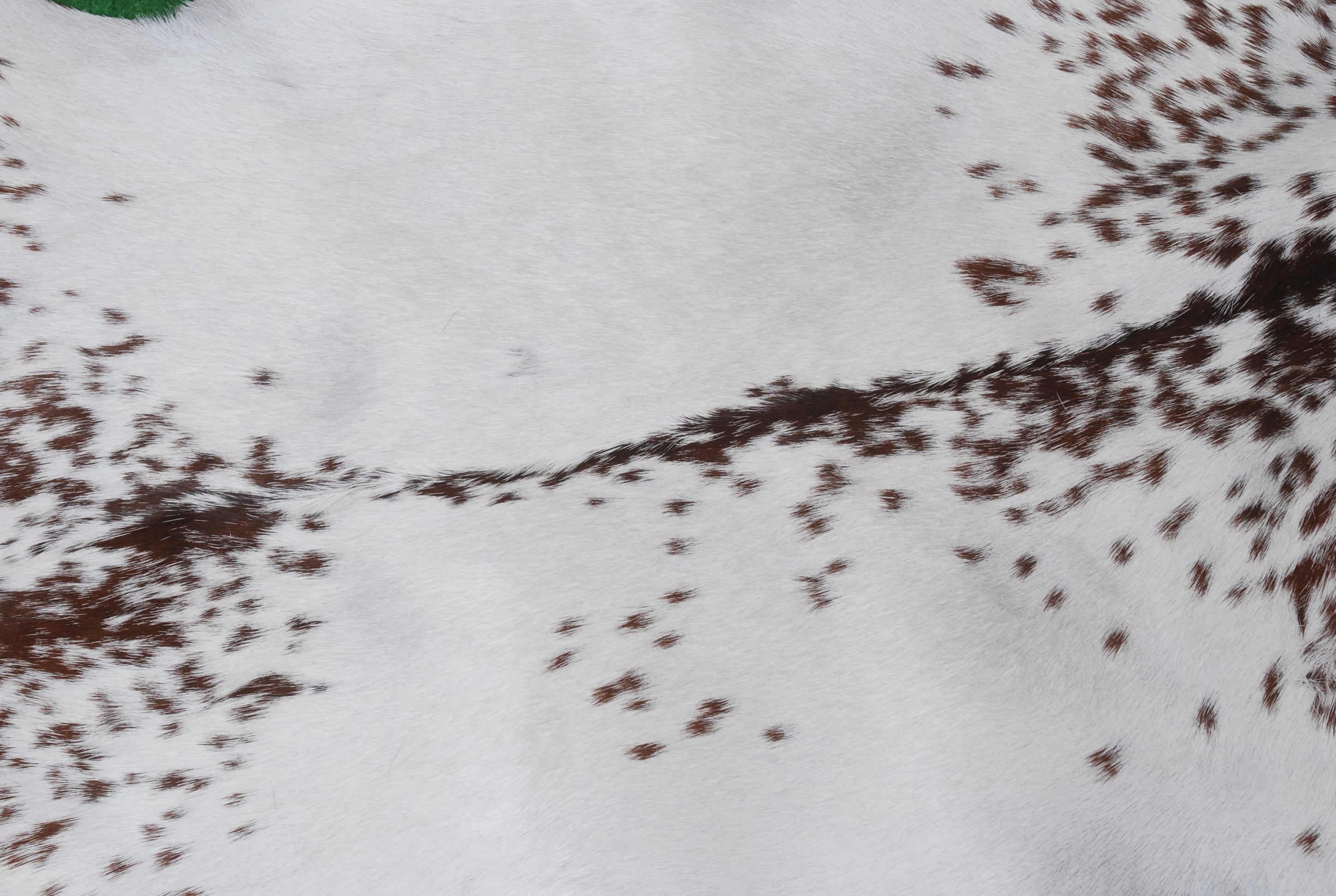 Brown and White Handmade Goat Skin Rug – Classic Elegance for Your Home