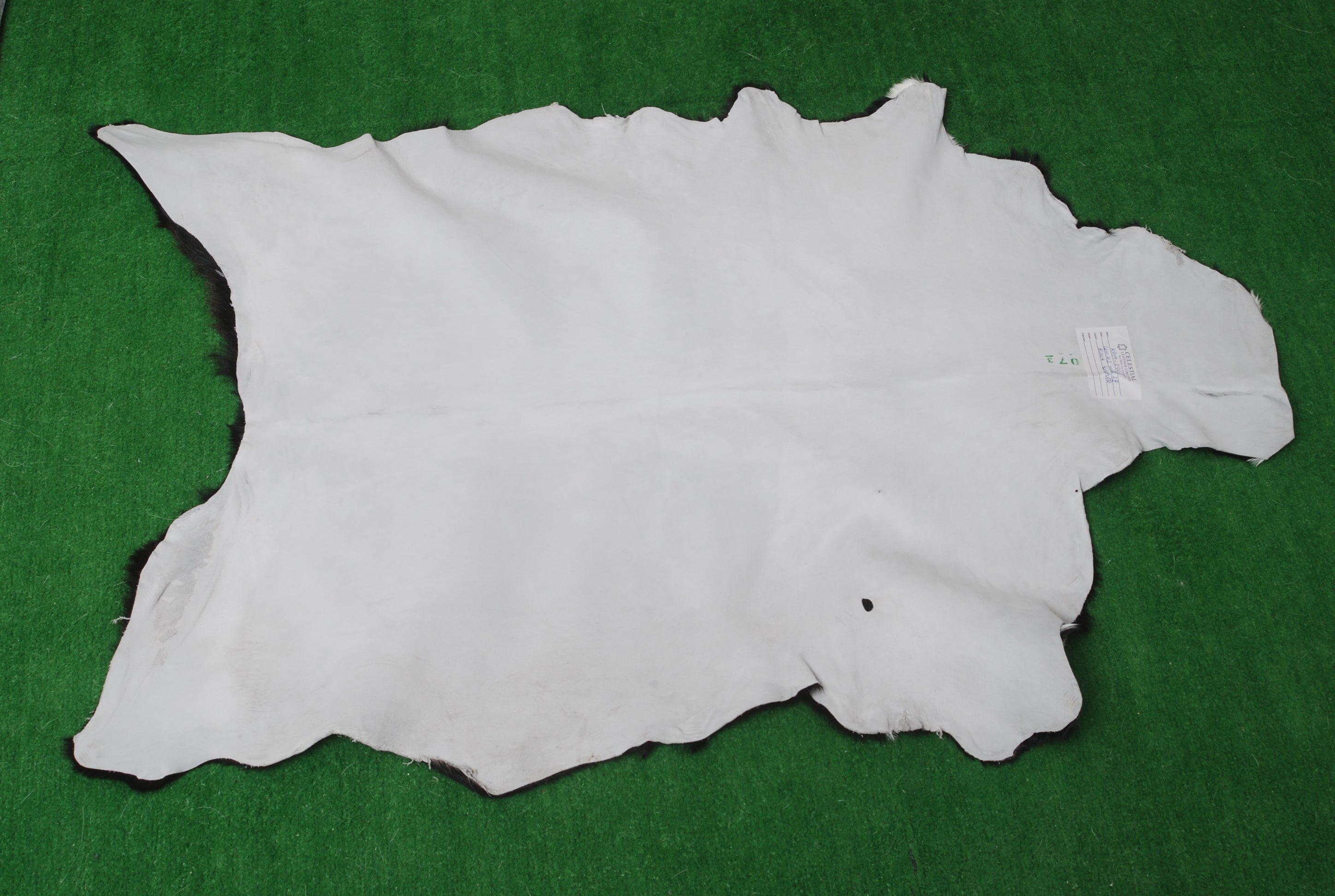 Luxurious Handmade Black & White Goat Skin Rug: Soft, Hypoallergenic, Sustainable, Non-Shedding & Unique - Add Nature's Beauty to Your Home - Celestial Leather Limited