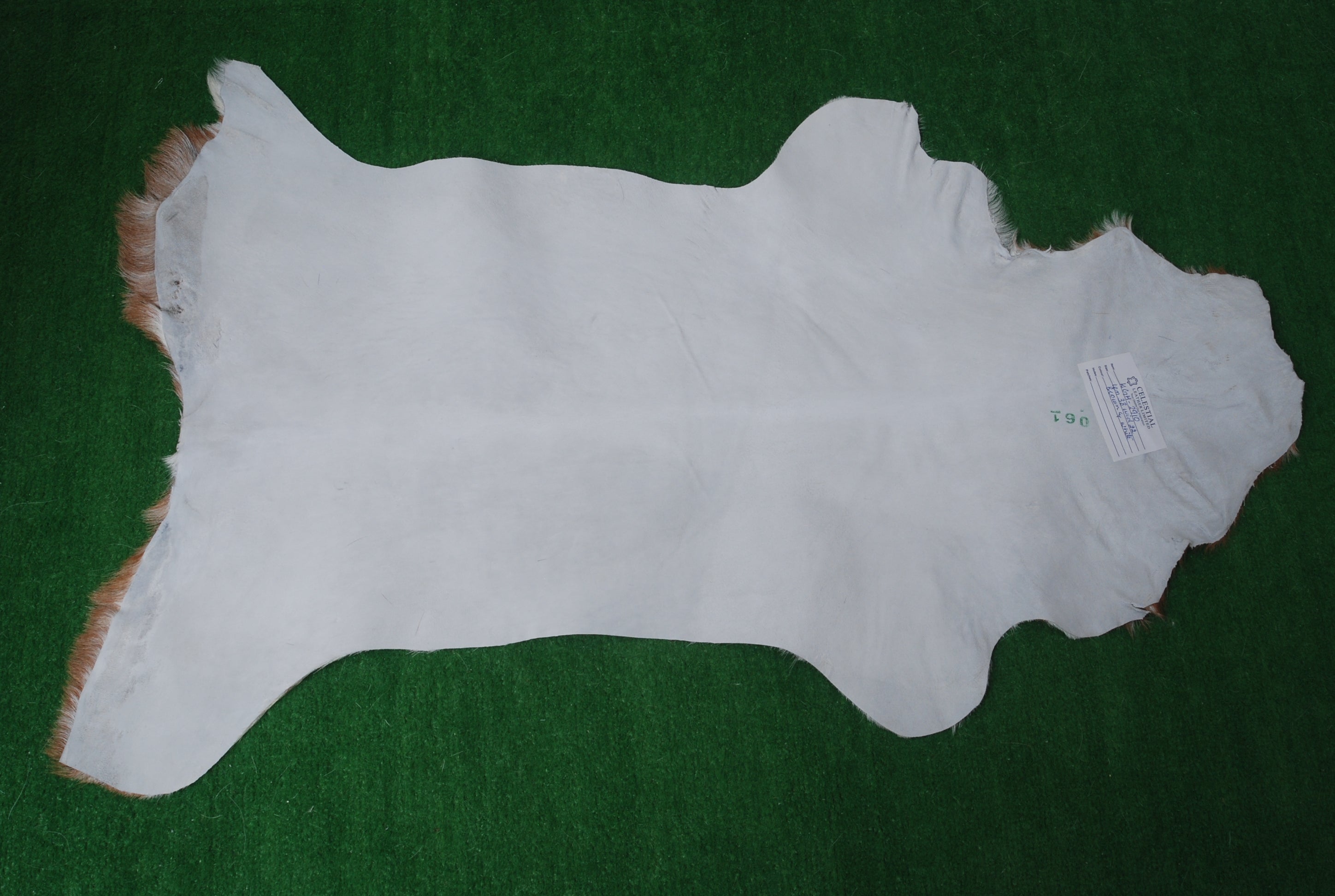 Brown and White Handmade Goat Skin Rug – Classic Elegance for Your Home