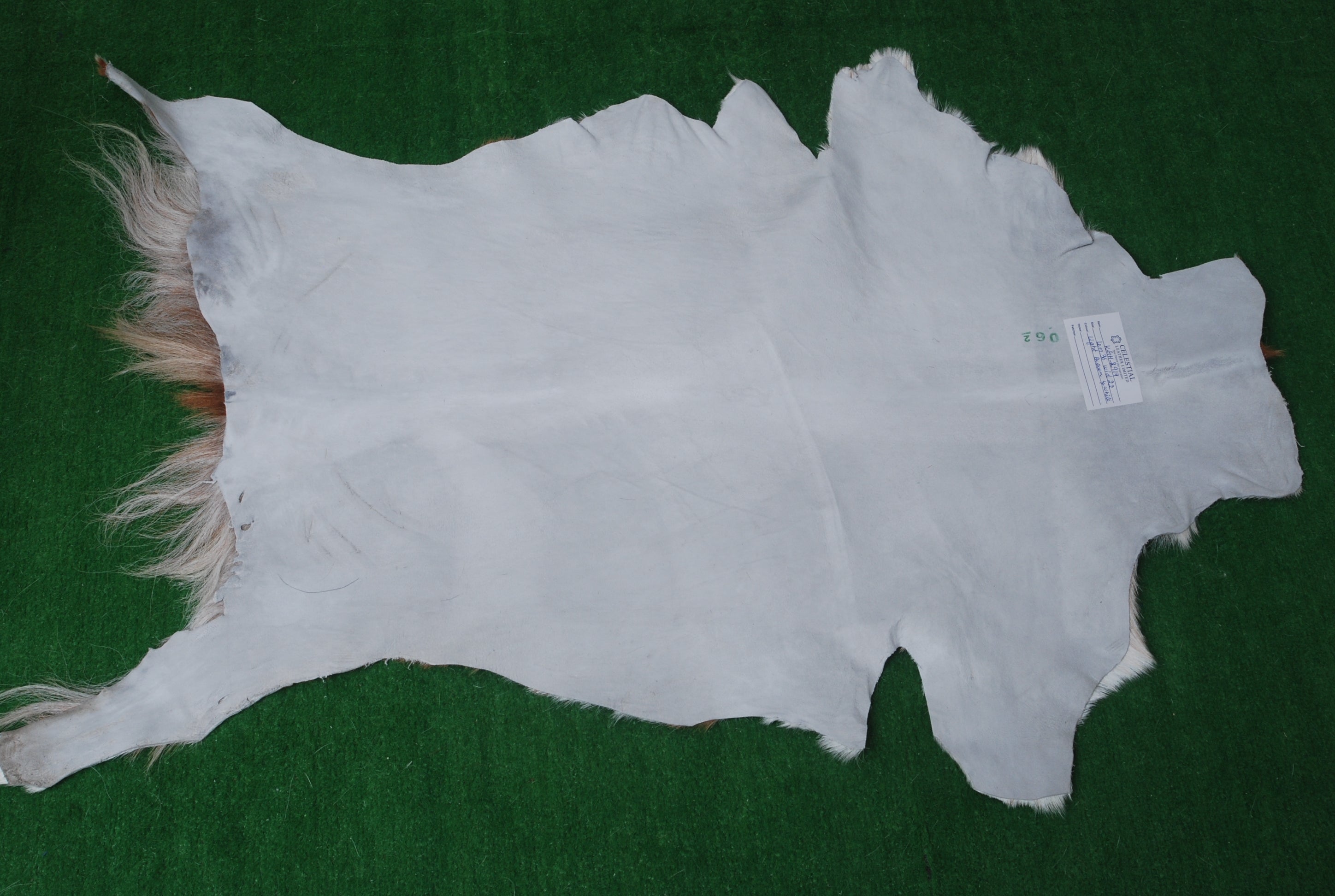 Brown and White Handmade Goat Skin Rug – Classic Elegance for Your Home