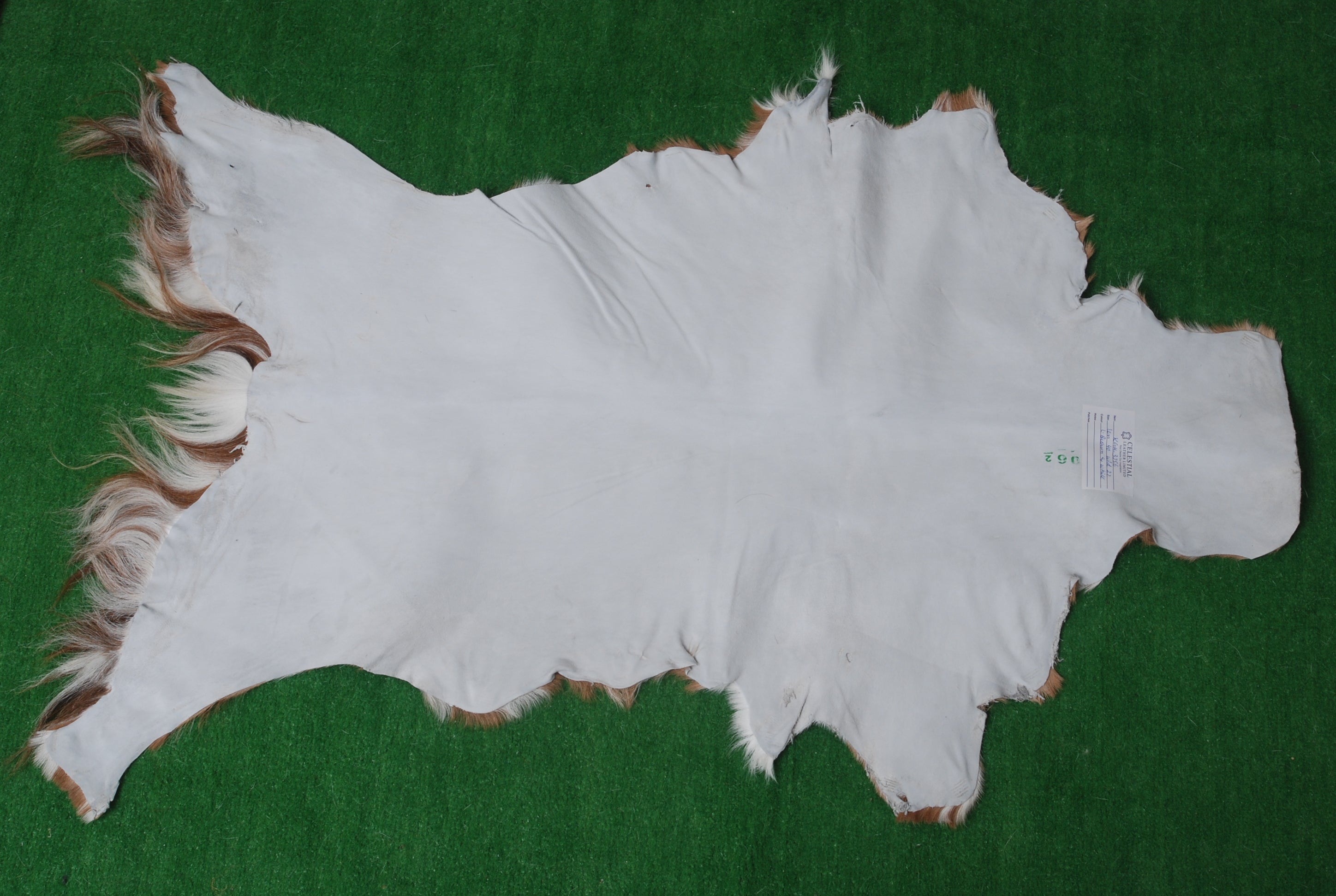 Rustic Brown and White Goat Skin Rug - Unique Pattern for Modern and Classic Décor