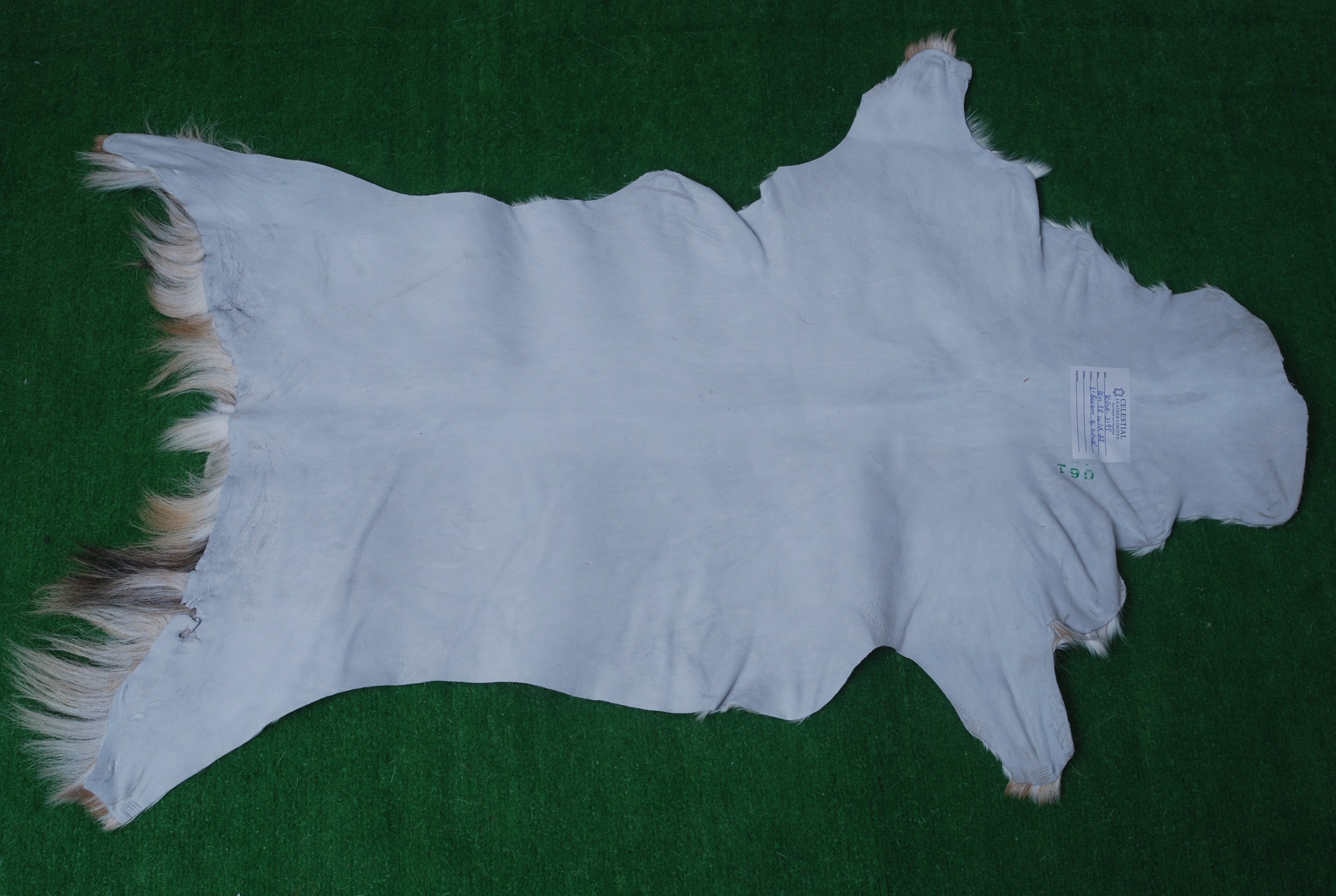 Handcrafted Brown and White Goat Skin Rug - Soft, Durable, and Elegant Décor - Celestial Leather Limited