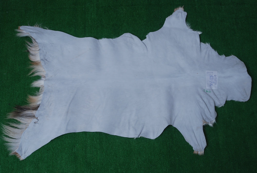 Handcrafted Brown and White Goat Skin Rug - Soft, Durable, and Elegant Décor - Celestial Leather Limited