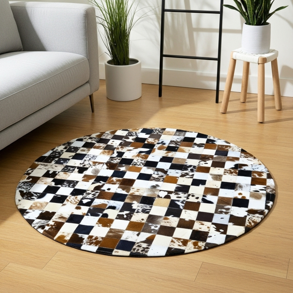 Round checkered rug on a wooden floor with a gray sofa and plants in the background.