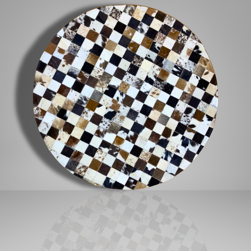 Round table top with a checkered pattern of cowhide leather on a gray background