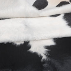 Luxurious Dark Brown & White Cowhide Rug - Medium Size for Modern Home Decor - Celestial Leather Limited
