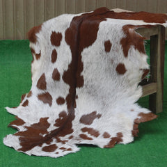 Luxurious Brown and White Goat Skin Rug - Premium Hair-On, Natural, and Sustainable - Elegant Home Decor Addition - Celestial Leather Limited